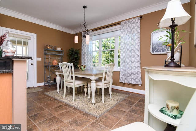 dining area featuring crown molding