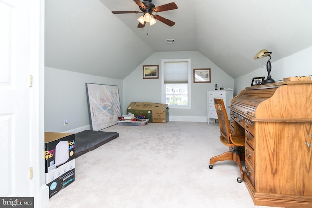 carpeted office with vaulted ceiling and ceiling fan