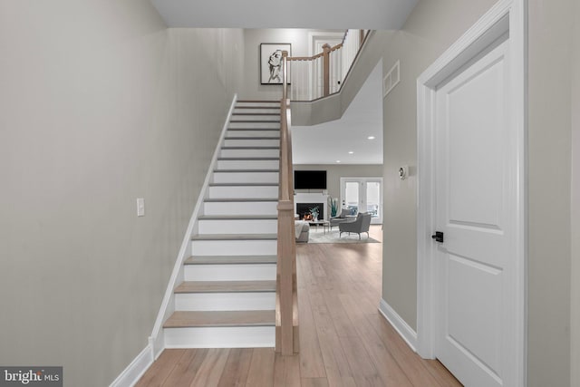 stairway featuring hardwood / wood-style flooring