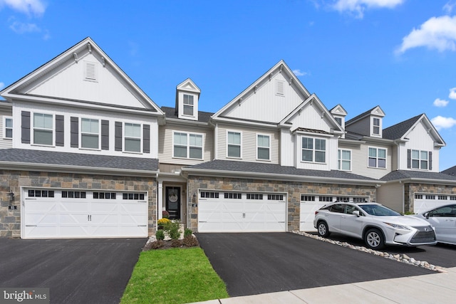 townhome / multi-family property featuring a garage