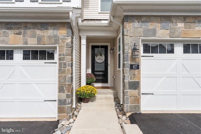 doorway to property featuring a garage