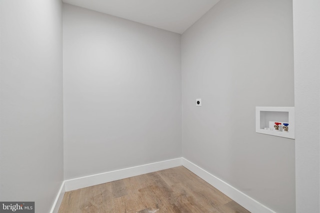 washroom featuring washer hookup, hookup for an electric dryer, and hardwood / wood-style floors