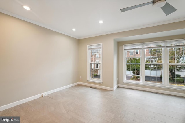 empty room with ceiling fan and ornamental molding