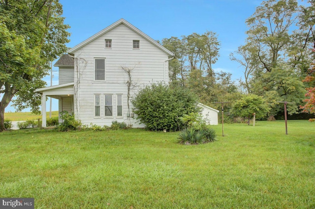 view of home's exterior with a lawn