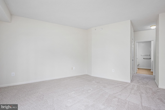 empty room featuring light colored carpet