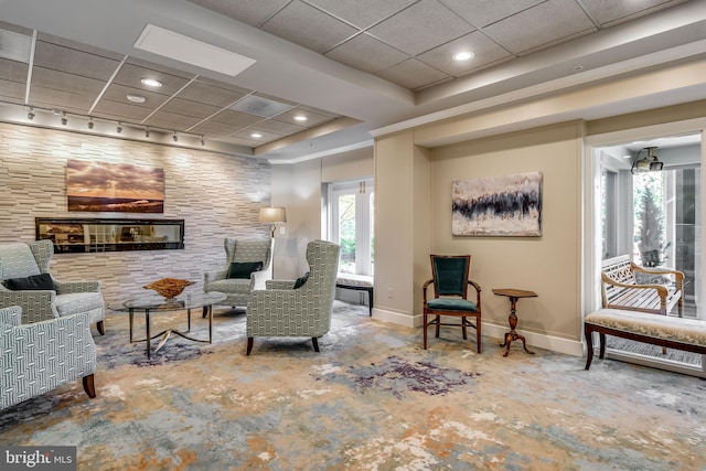 interior space featuring a drop ceiling and plenty of natural light