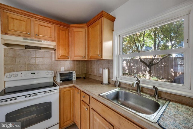 kitchen with sink, white range with electric stovetop, and decorative backsplash