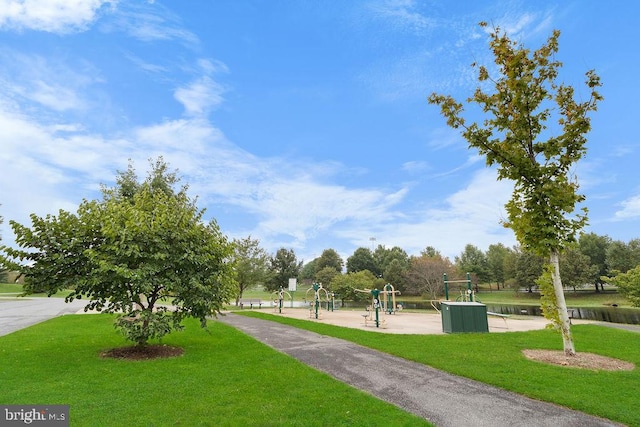 surrounding community with a playground and a lawn