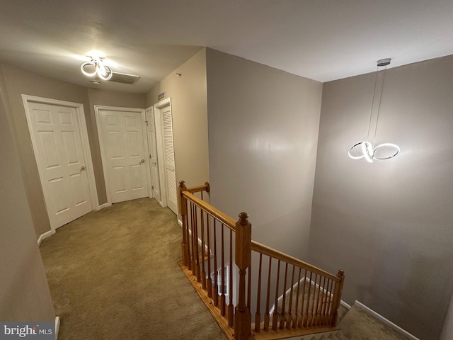 corridor featuring carpet floors