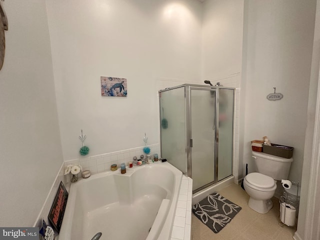 bathroom with toilet and separate shower and tub