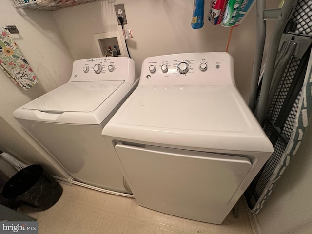 laundry room featuring independent washer and dryer