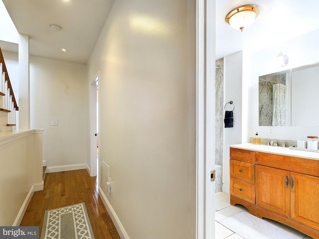 hall featuring light wood-type flooring and sink