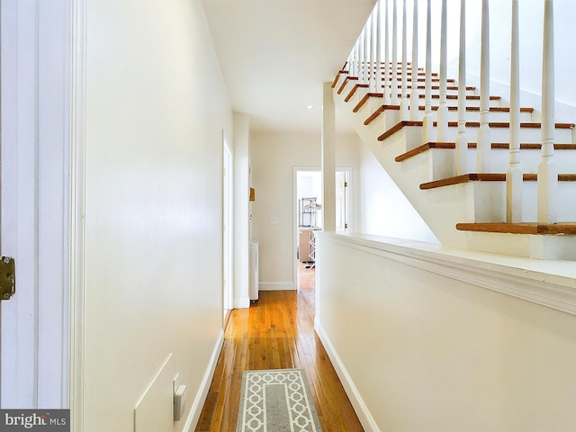 corridor featuring hardwood / wood-style floors