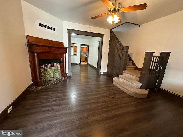 interior space with ceiling fan and dark wood-type flooring