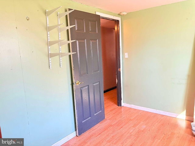 empty room featuring hardwood / wood-style flooring