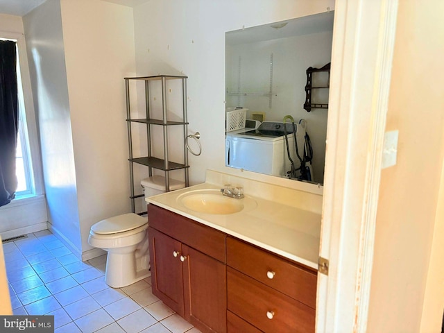 bathroom featuring tile patterned floors, independent washer and dryer, vanity, and toilet