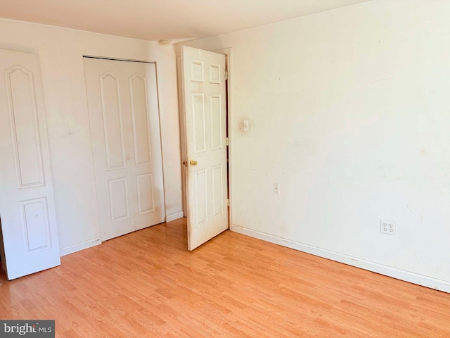 unfurnished bedroom featuring light wood-type flooring