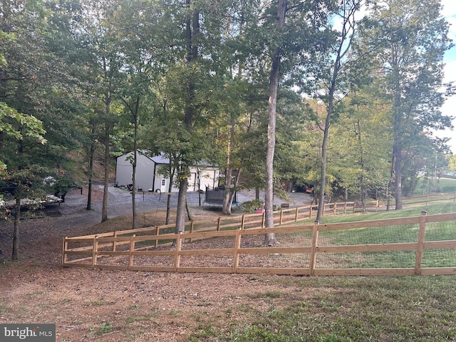 view of yard with a rural view