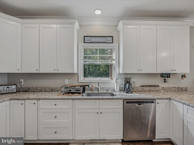 kitchen featuring white cabinets, sink, and stainless steel dishwasher