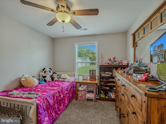 bedroom with ceiling fan and carpet floors