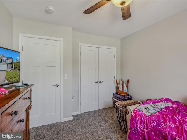 bedroom with ceiling fan, a closet, and carpet flooring