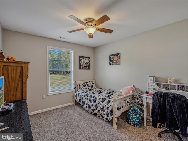 bedroom with ceiling fan and carpet flooring