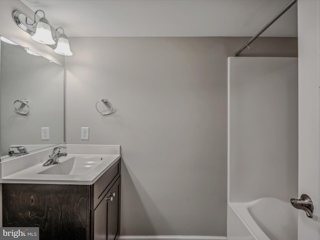 bathroom with shower / washtub combination and vanity