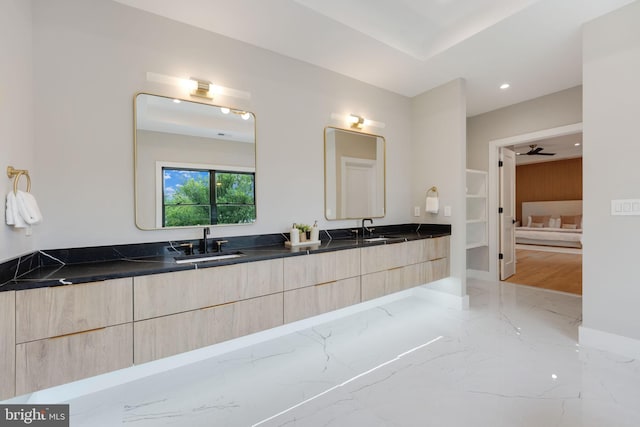 bathroom featuring vanity and ceiling fan