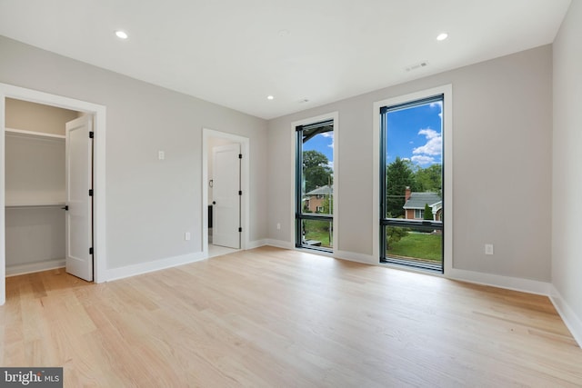 unfurnished room featuring light hardwood / wood-style floors