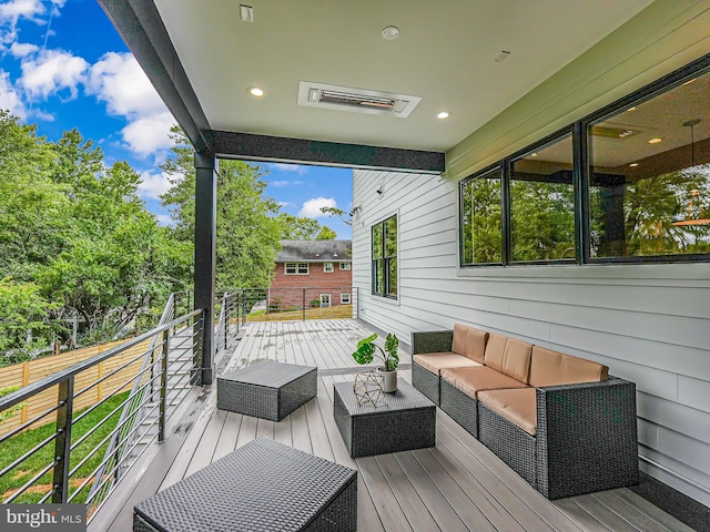 wooden deck featuring an outdoor living space