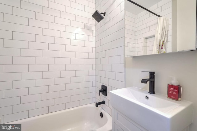 bathroom with shower / bath combination with curtain and sink