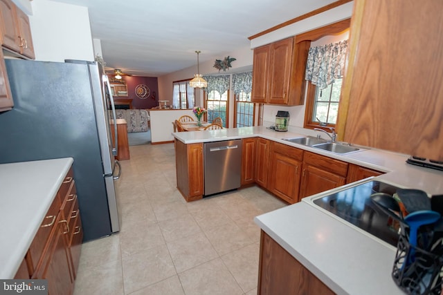 kitchen with ceiling fan, kitchen peninsula, appliances with stainless steel finishes, decorative light fixtures, and light tile patterned floors