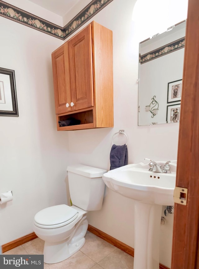 bathroom featuring tile patterned floors, sink, and toilet