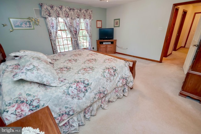 bedroom with light carpet