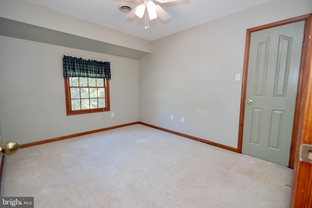 carpeted empty room with ceiling fan