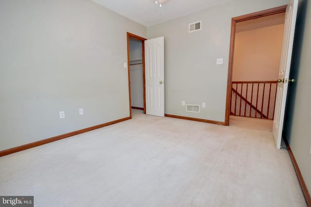 unfurnished bedroom with light carpet