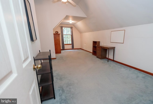 bonus room with lofted ceiling, ceiling fan, and light colored carpet