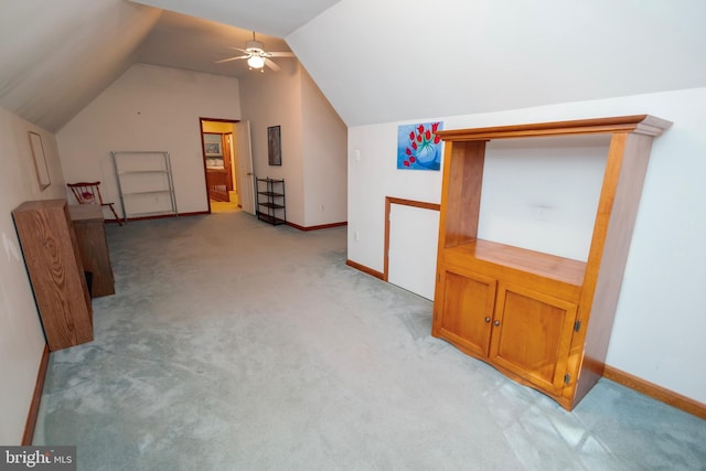 bonus room with ceiling fan, light colored carpet, and lofted ceiling