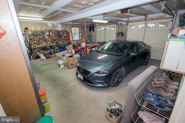 garage featuring a workshop area and a garage door opener