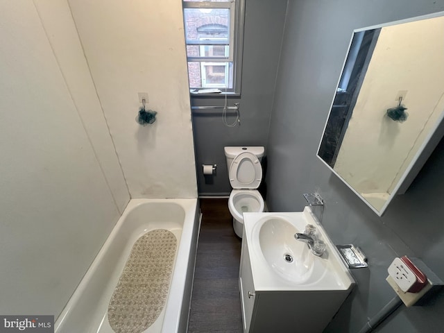 full bathroom with vanity, plus walk in shower, and toilet