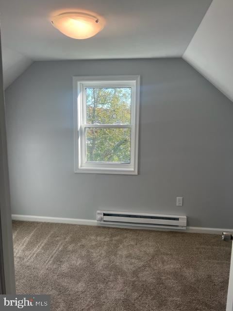 bonus room featuring lofted ceiling, baseboard heating, and carpet flooring