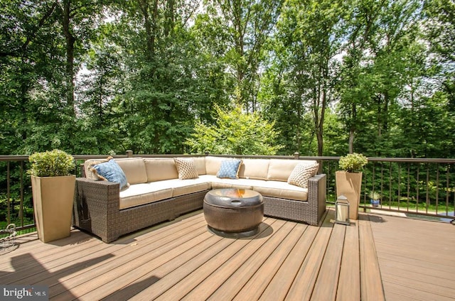 wooden terrace with outdoor lounge area