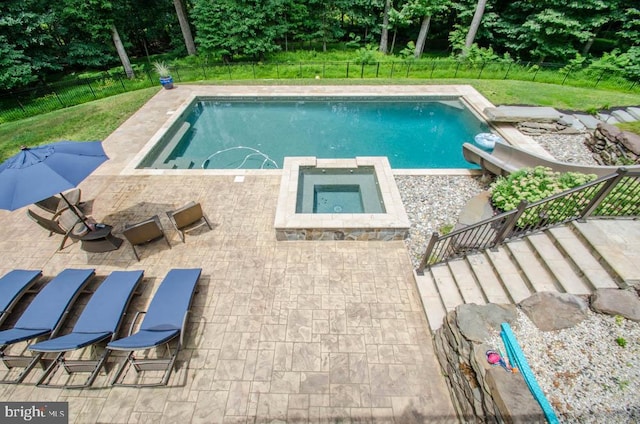 view of pool featuring a patio