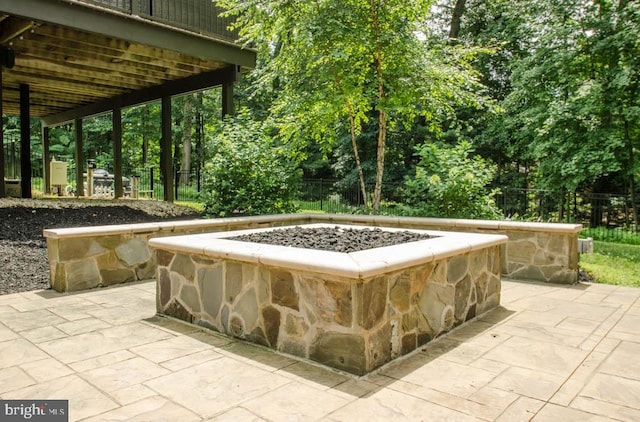 view of patio / terrace with a fire pit