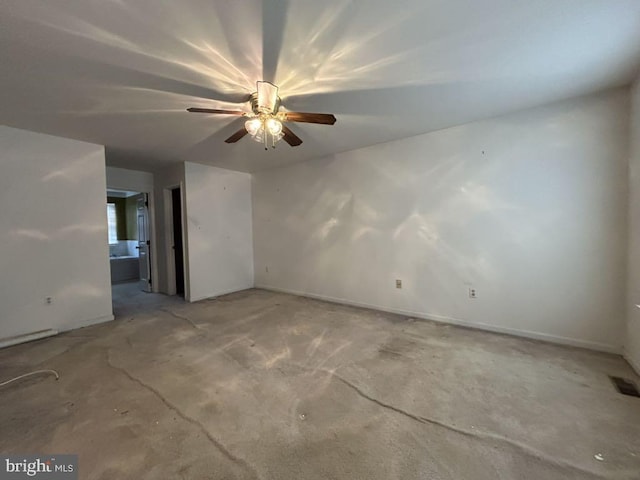 empty room with concrete flooring and ceiling fan