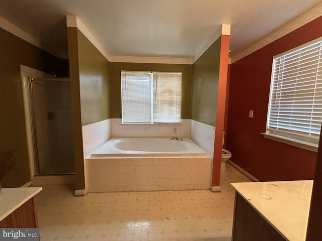 full bathroom with ornamental molding, shower with separate bathtub, vanity, and toilet