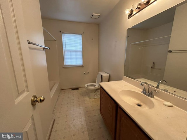 full bathroom featuring tub / shower combination, vanity, and toilet