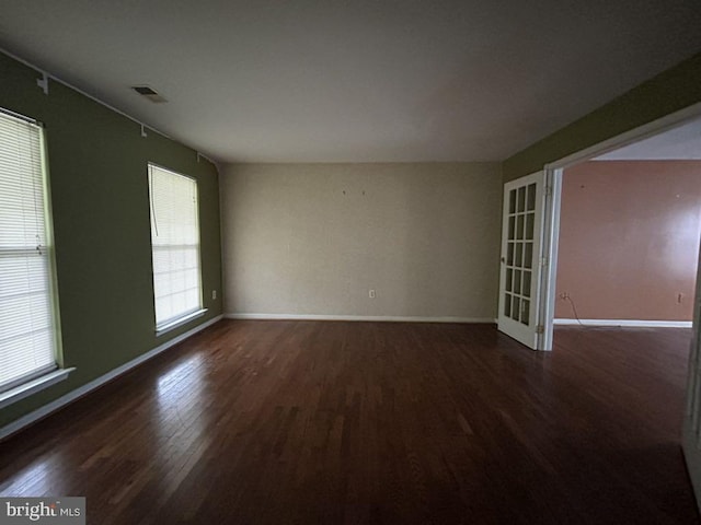 empty room featuring dark wood-type flooring