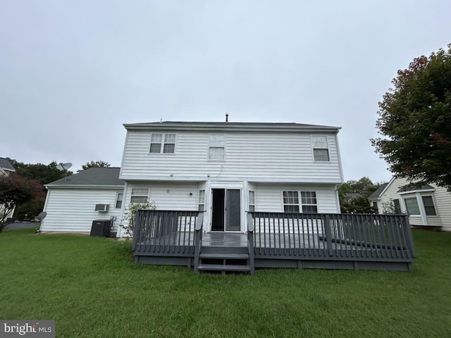 rear view of house featuring a deck, a yard, and central air condition unit