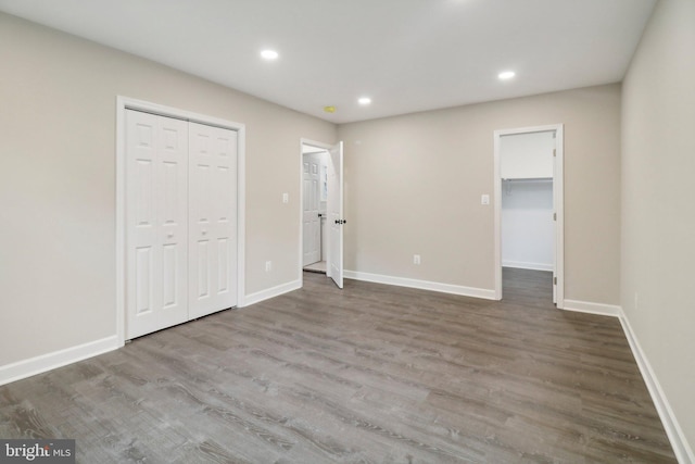 unfurnished bedroom with wood-type flooring